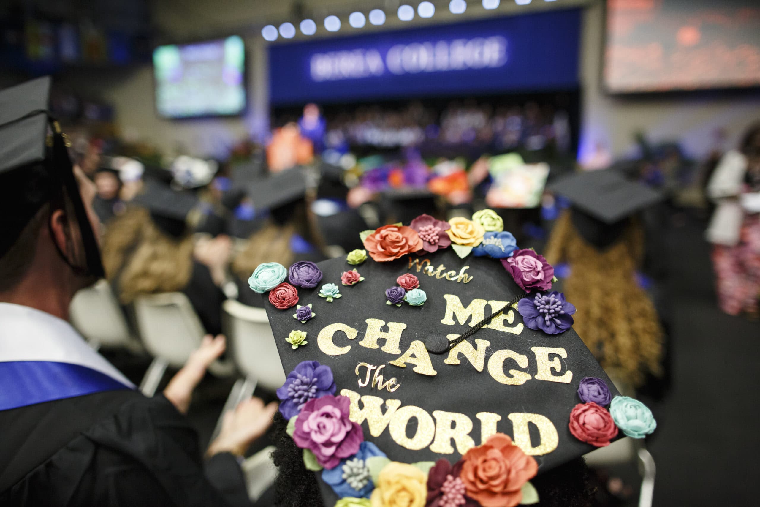Decorated Graduation cap that reads "watch me change the world".