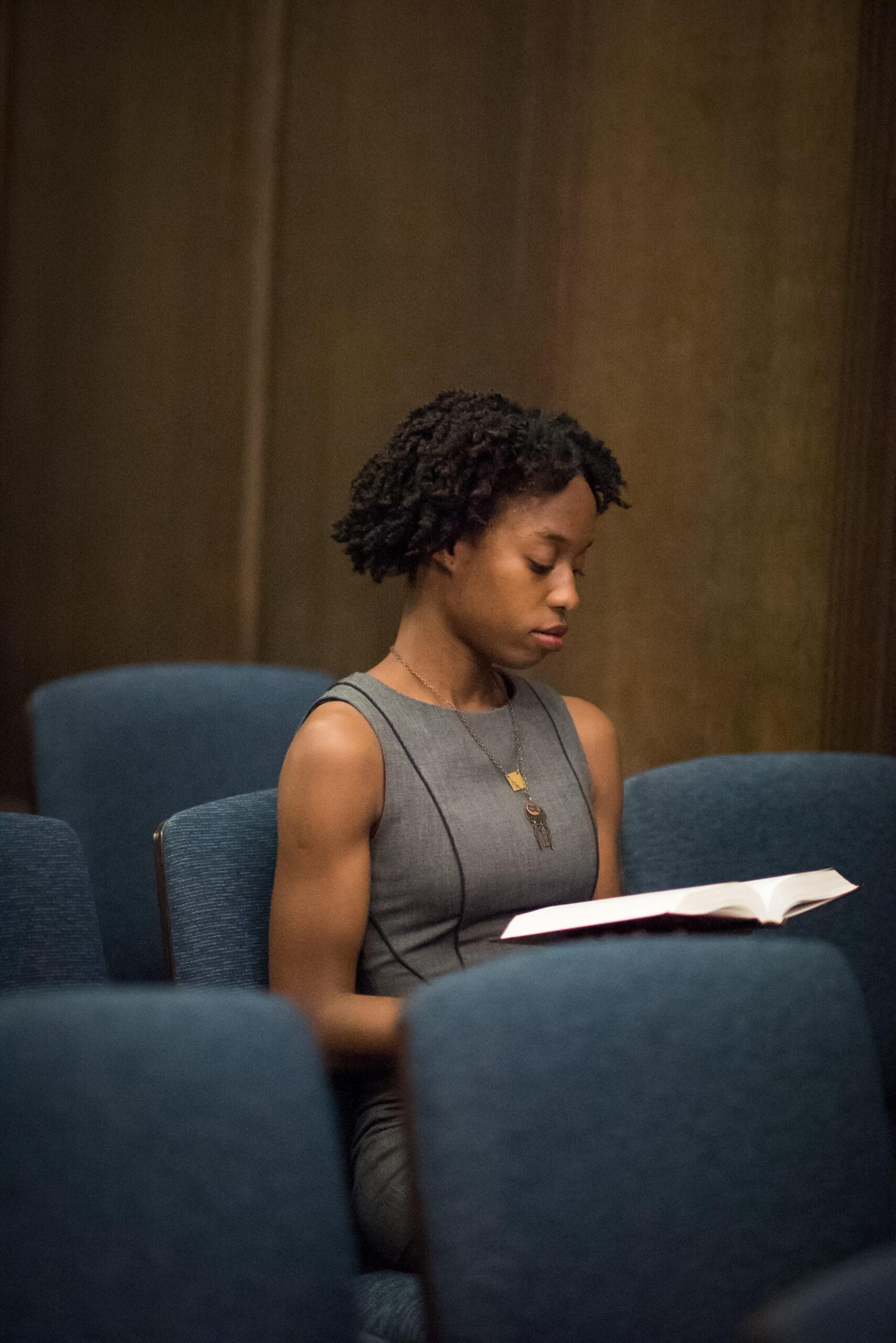 student reading a Bible in Danforth Chapel