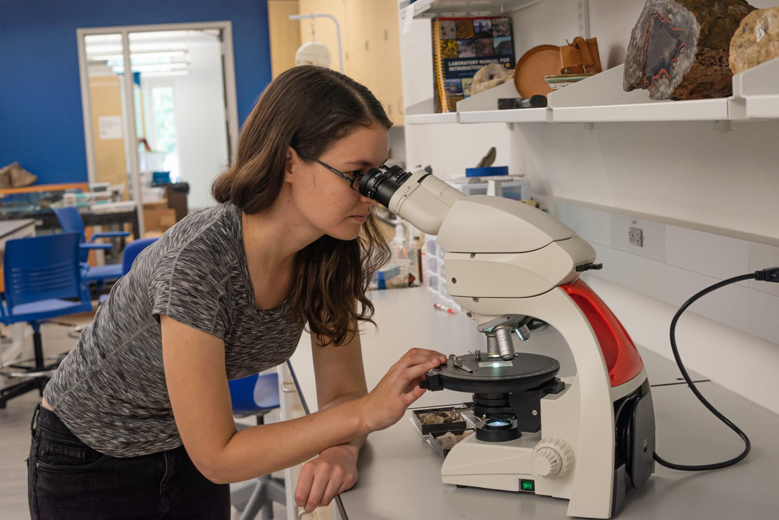 Berea College Geology professor Dr. Suzanne Birner looks through microscope